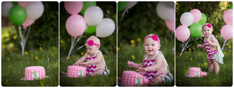 baby sitting in the green grass smashing her pink buttercream cake, she is wearing pink chevron pattern dress and have balloons around her